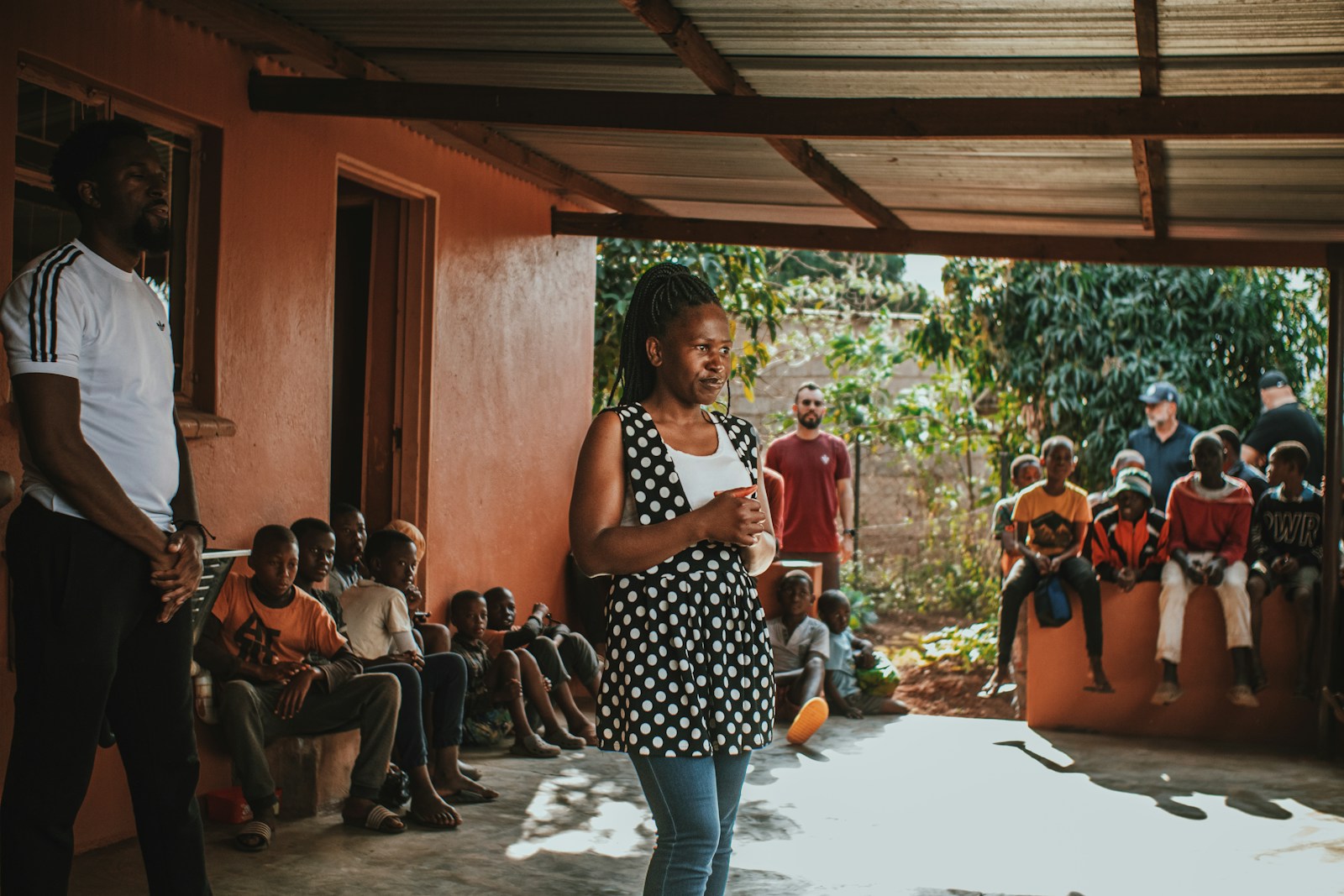 a woman standing in front of a group of people